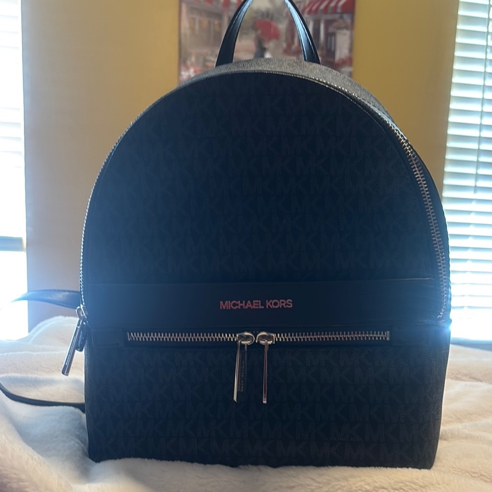 Michael Kors Black Backpack with Dome Top and Smooth Finish, used twice.